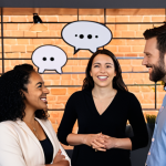 Authentic Connection**

Prompt:  A diverse group of professionals engaged in genuine conversation at a modern co-working space. Focus on positive body language, eye contact, and active listening. Soft, warm lighting.  Include subtle branding elements related to networking, such as stylized speech bubbles or a minimalist logo representing connection.  Emphasis on authenticity and approachability.
**